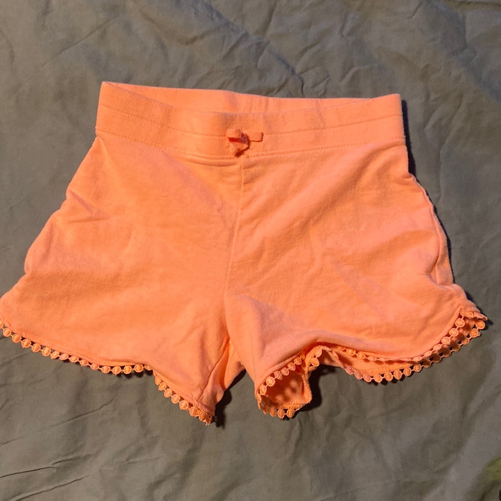 Girls Shorts. Size 7. Lace-like detailing. Jumping beans brand. Orangish pink